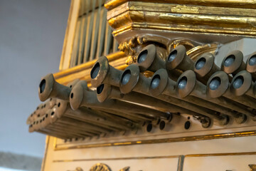 Old pipe organ from the chapel with wooden details. Corpus Christi Convent, Vila Nova de Gaia, Portugal.