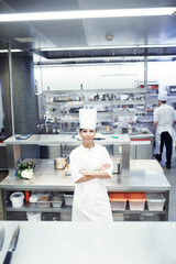 Chef, portrait and proud with professional kitchen, cooking and hospitality industry employee....