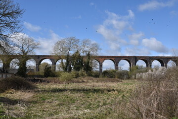 Fototapeta na wymiar the arches of the harringworth viaduct (or welland viaduct) one of the longest railway viaducts across a valley in the uk