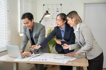 Asian businessmen, women and men Talk about new projects, presents at home office.