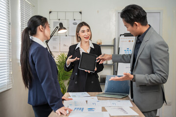 Asian businessmen, women and men Talk about new projects, presents at home office.