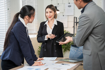 Asian businessmen, women and men Talk about new projects, presents at home office.