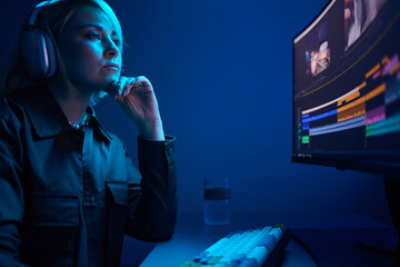 Beautiful Female Video Editor Works with Footage on Her Personal Computer, She Works in Creative...