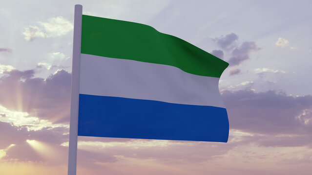 Flag of Sierra Leone in the wind on a sunset sky