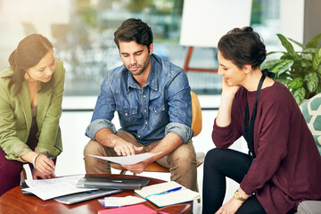 Fototapeta premium People, teamwork or writers planning with paperwork in meeting for solution, conversation and discussion. Notes, journalists and editors in workspace for talking, creative ideas and collaboration