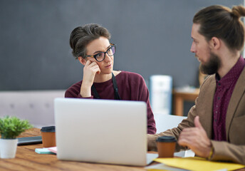 Training, meeting or business people with laptop in office for feedback, report or review...