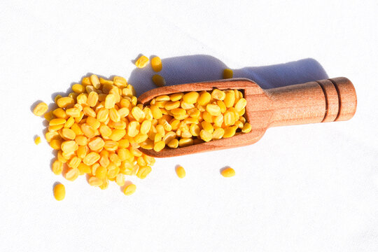 Traditional Indian deep-fried moong dal namkeen - The mung bean, alternatively known as the green gram, maash, or moon in spooon پیلی دال