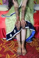 Bangalore, India 9th April 2024: Indian bride's wedding henna mehendi mehndi feet close up. Henna...