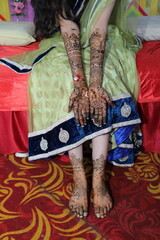 Bangalore, India 9th April 2024: Indian bride's wedding henna mehendi mehndi feet close up. Henna...