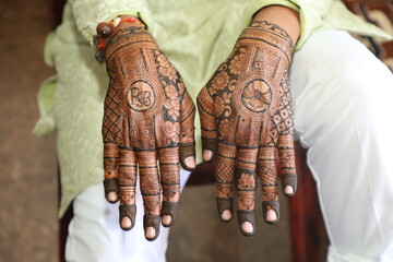 Bangalore, India 9th April 2024: Indian bride's wedding henna mehendi mehndi feet close up. Henna...