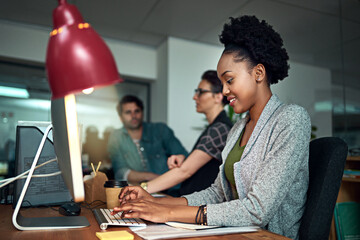 Smile, computer and black woman typing in office for creative research with project online. Happy,...