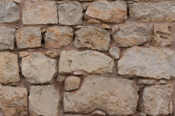 Background made from stones of a very old wall