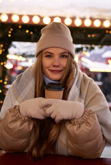 Portrait of young woman on Christmas market