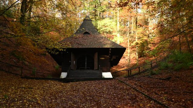 Chapel of St. Roch in Krasnobr&oacute;d in sunny autumn among golden leaves.