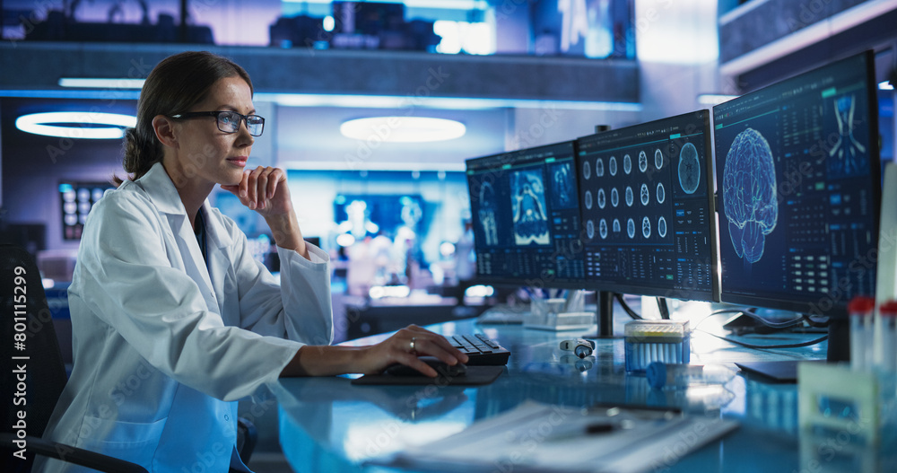 Fototapete caucasian female neuroscientist using desktop computer to analyze mri scans of human brain in busy r