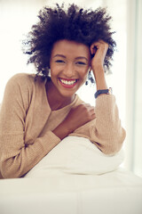 Laugh, happy and portrait of black woman in home for relaxing, chill and rest on weekend....