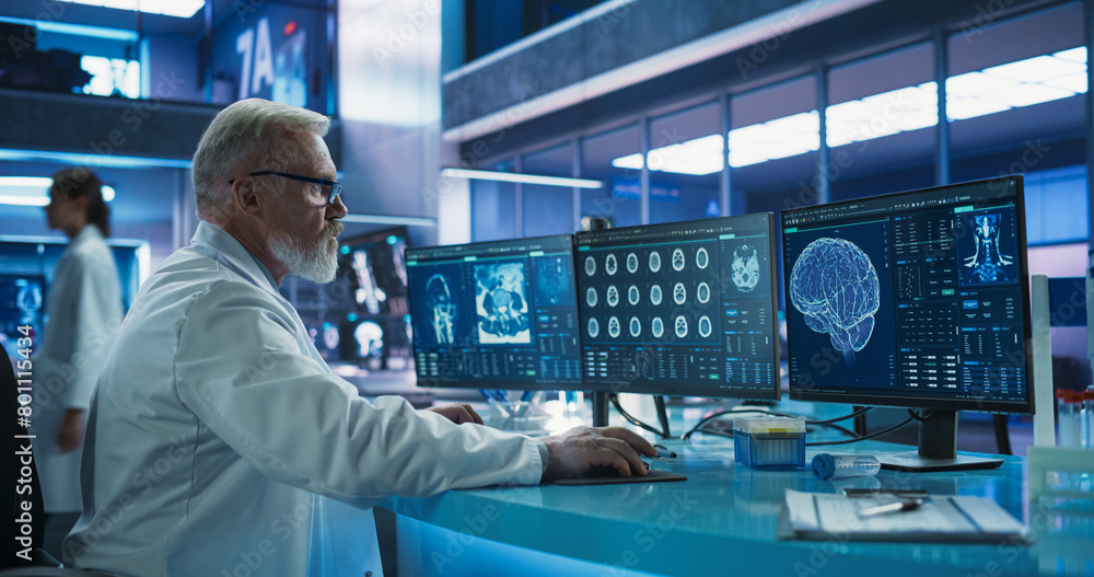 Poster Senior Male Neuroscientist Using Desktop Computer To Analyze MRI Scans Of Brain In Medical Research Center Laboratory. Caucasian Doctor Studying CT Scan Of Stroke Patient's Brain, Finding Solutions.