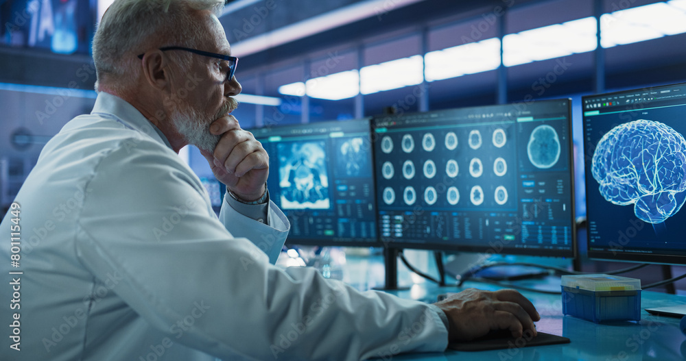 Poster Senior Male Neuroscientist Using Desktop Computer To Analyze MRI Scans Of Brain In Medical Research Center Laboratory. Caucasian Doctor Studying CT Scan Of Stroke Patient's Brain, Finding Solutions.