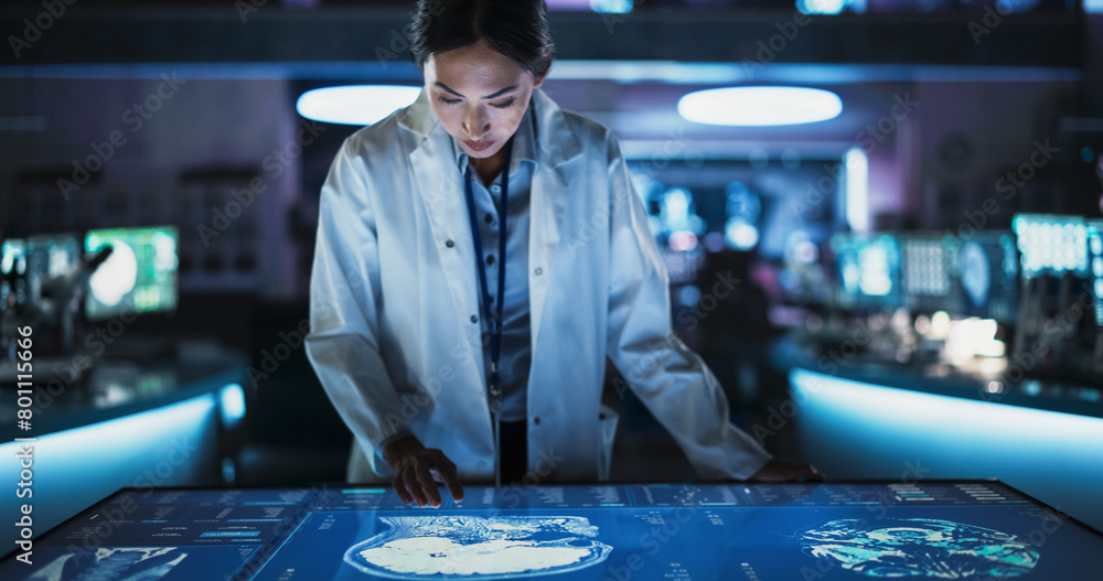 Poster Female Asian Neuroscinetist Using Interactive Touch Screen Table With MRI Scans On Display In Modern Biotechnology Research Center. Doctor Developing Innovative Devices For People With Brain Damage.