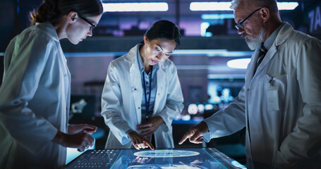 Modern Hospital Medical Research Center: Diverse Colleagues Gathered Around Interactive Touch...