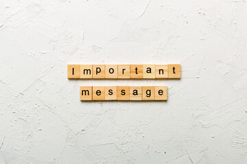 Important message word written on wood block. Important message text on cement table for your...