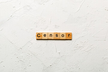 Censor word written on wood block. Censor text on cement table for your desing, concept - obrazy, fototapety, plakaty
