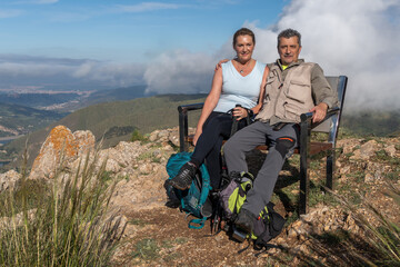 Couple Enjoying Hike with Cloudy Mountain View