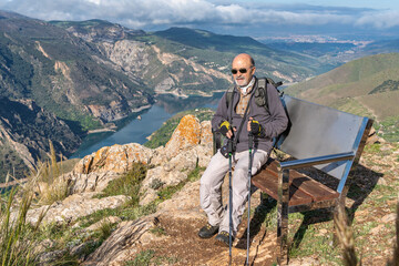 Adventurous Senior Enjoying Hiking Break