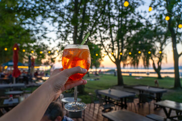 Drinking cocktail in a stylish restaurant next to lake Balaton
