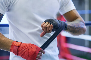 Gym, boxing or man wrapping hands for workout, exercising and training for competition....