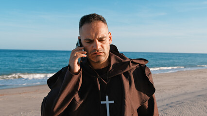 Monk during An Important Phone Call For The Christian Priest 