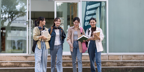 Female student walking to class with friends and chatting about the class - obrazy, fototapety, plakaty