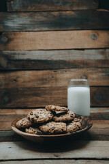  A bowl of cookies in a wooden bow 
