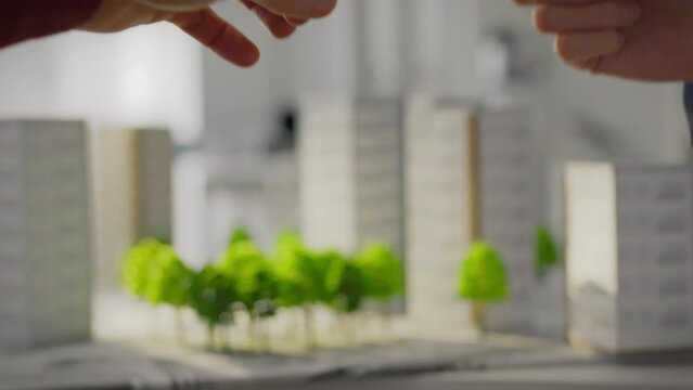 A real estate manager hands over the keys to the purchased apartment to buyers who come to the construction company&rsquo;s office to complete the transaction and receive the keys to the apartment