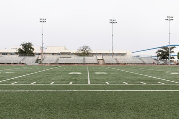 Empty stadium with green lawn