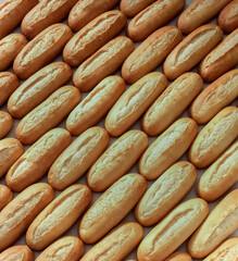 Background of mini loaves of bread seen from above