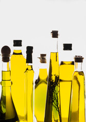 set of different types of oil bottles backlit