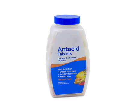 Chewable Antacid tablets for medication, health care concept. Close up of of chewable antacid acid reducer tablets with fruit flavor bottle container only. Isolated on white background