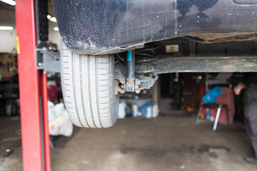 Close up of a car suspension in a car repair shop. Car service.