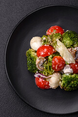 Delicious fresh juicy salad with quail eggs, cherry tomatoes, lettuce leaves