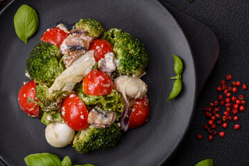 Delicious fresh juicy salad with quail eggs, cherry tomatoes, lettuce leaves