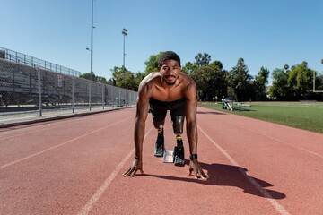 Paralympic sprinter with prosthetic blades started racing from a starting block