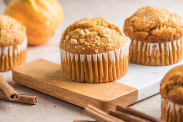 Autumn pumpkin cupcakes or  baked muffins with fresh pumpkin for Thanksgiving day.