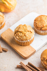 Autumn pumpkin cupcakes or  baked muffins with fresh pumpkin for Thanksgiving day.