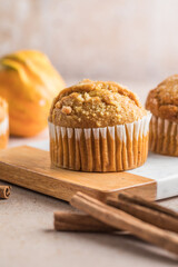 Autumn pumpkin cupcakes or  baked muffins with fresh pumpkin for Thanksgiving day.