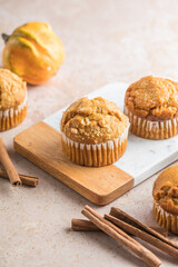 Autumn pumpkin cupcakes or  baked muffins with fresh pumpkin for Thanksgiving day.