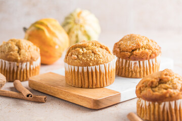 Autumn pumpkin cupcakes or  baked muffins with fresh pumpkin for Thanksgiving day.