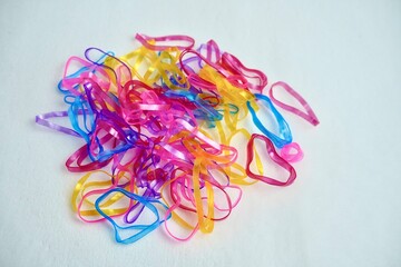 Colorful group of many hair tie rubber band elastic plastic equipments for hair accessories. Object...