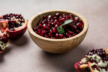 Pieces and grains of ripe pomegranate. Pomegranate seeds.