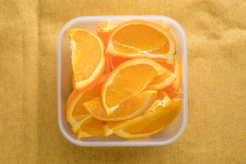 Orange slice in plastic transparent container box